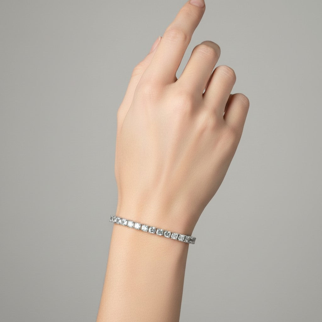 My Store 4 custom princess cut diamond tennis bracelet in white gold worn on a woman's wrist