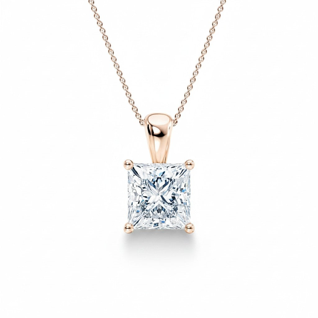 My Store 4 princess-cut diamond solitaire pendant in 18K yellow gold with a tapered drop bail on a fine cable chain.