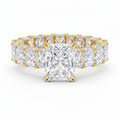 My Store 4 radiant cut diamond eternity band in yellow gold with a hidden halo setting and shared prong diamonds.