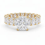 My Store 4 radiant cut diamond eternity band in yellow gold with a hidden halo setting and shared prong diamonds.