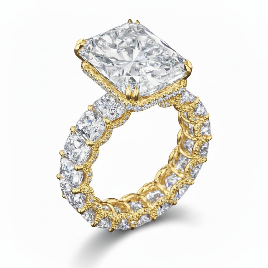 My Store 4 radiant cut diamond eternity band in yellow gold with a hidden halo and four-prong center setting.