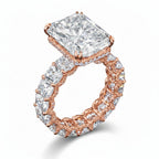 My Store 4 radiant cut diamond eternity band in rose gold with a hidden halo and double-claw prong center setting.