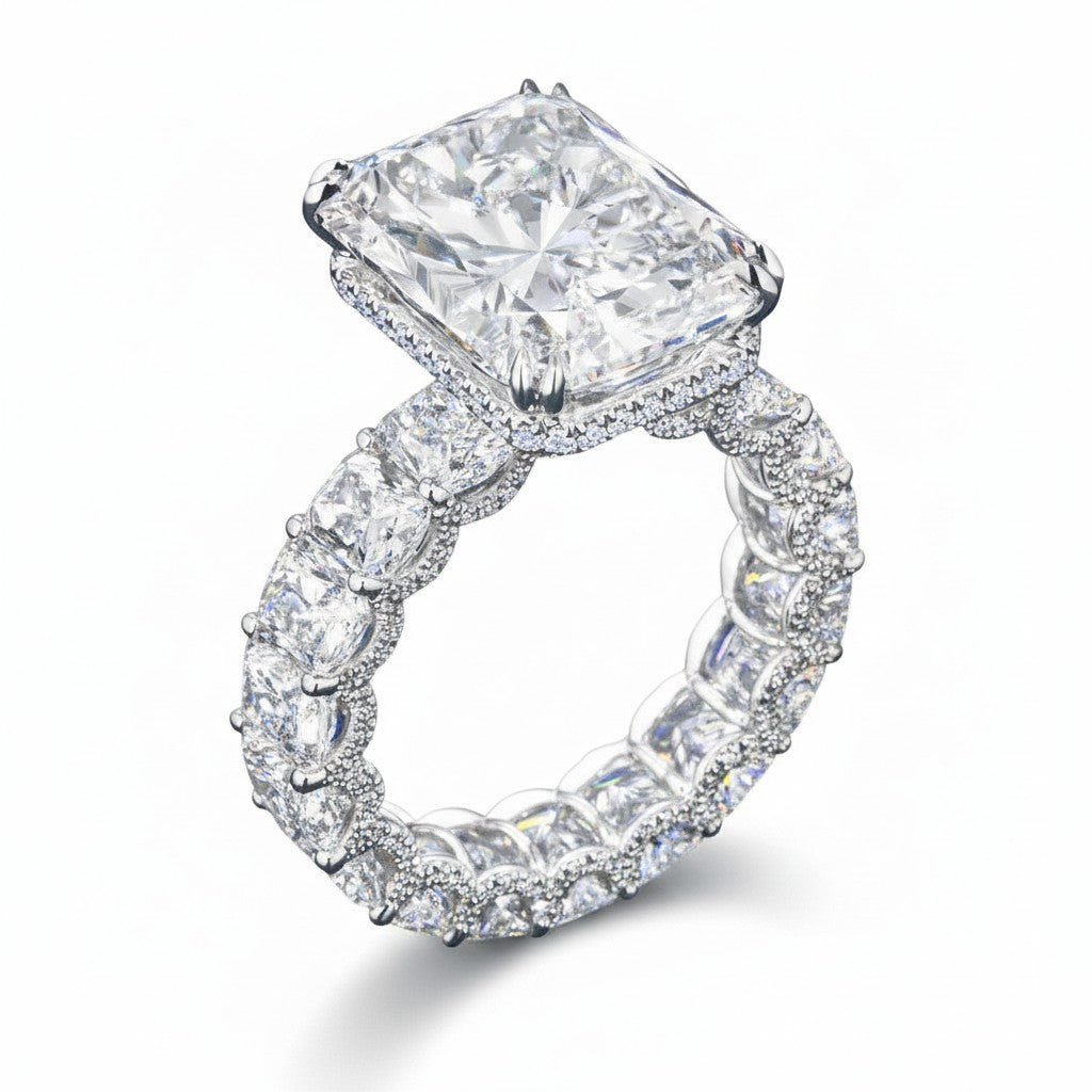 My Store 4 radiant cut diamond eternity band with a hidden halo and four-prong setting in 18K white gold.