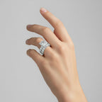 My Store 4 radiant cut diamond engagement ring and matching eternity band set with hidden halos on a woman's hand.