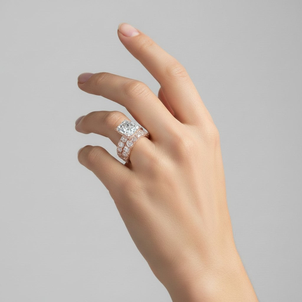 My Store 4 radiant cut diamond engagement ring and eternity band set in rose gold with hidden halo on a hand