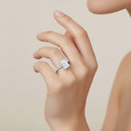 My Store 4 radiant cut engagement ring with a hidden halo and pavé diamond band worn on a woman's finger.
