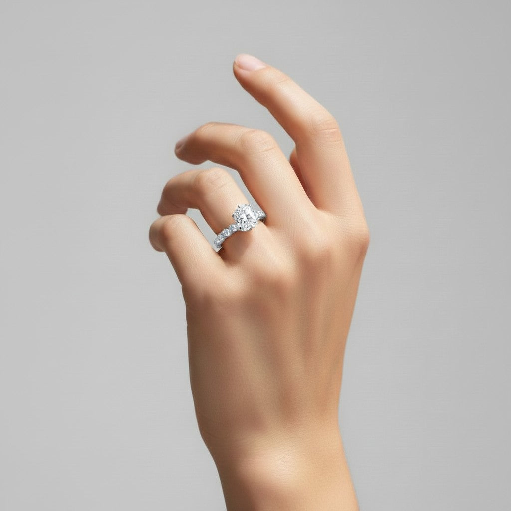 My Store 4 radiant cut solitaire engagement ring with a round diamond eternity band worn on a woman's hand.