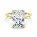 My Store 4 radiant cut solitaire engagement ring in solid yellow gold with a hidden halo and split shank design.