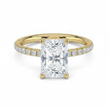 My Store 4 radiant cut solitaire engagement ring in yellow gold with a French pavé diamond band and hidden halo.
