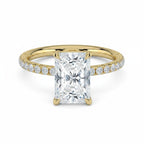 My Store 4 radiant cut solitaire engagement ring in yellow gold with a French pavé diamond band and hidden halo.