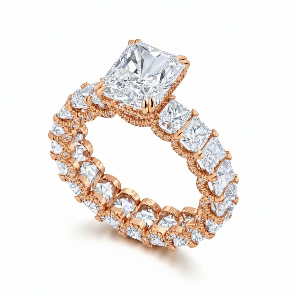 My Store 4 radiant cut diamond eternity band in rose gold with a hidden halo and center stone on a white background.