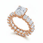 My Store 4 radiant cut diamond eternity band in rose gold with a hidden halo and center stone on a white background.