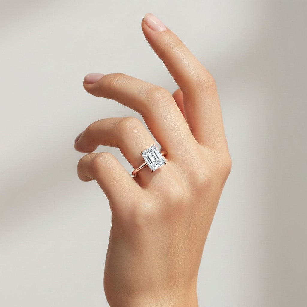 My Store 4 radiant cut engagement ring with a hidden halo on a hand, crafted in polished rose gold.