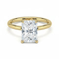 My Store 4 radiant cut solitaire engagement ring with a high-polished yellow gold band and four-prong setting.