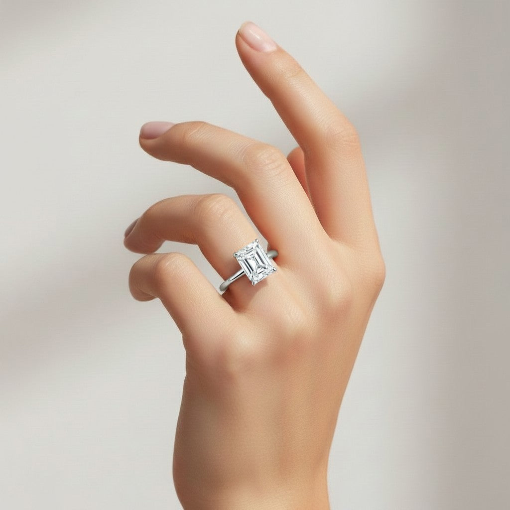 My Store 4 radiant cut solitaire engagement ring with hidden halo on a hand, featuring a sleek white gold band.
