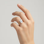 My Store 4 radiant cut solitaire engagement ring with a hidden halo on a hand, featuring a polished yellow gold band.