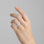 My Store 4 radiant cut three-stone engagement ring with trillion side diamonds on a woman's hand in yellow gold.