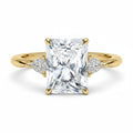 My Store 4 radiant cut three-stone engagement ring with trillion side diamonds in polished yellow gold