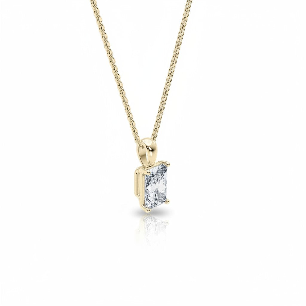 My Store 4 radiant-cut diamond solitaire pendant in 18K yellow gold on a fine cable chain against a white background.