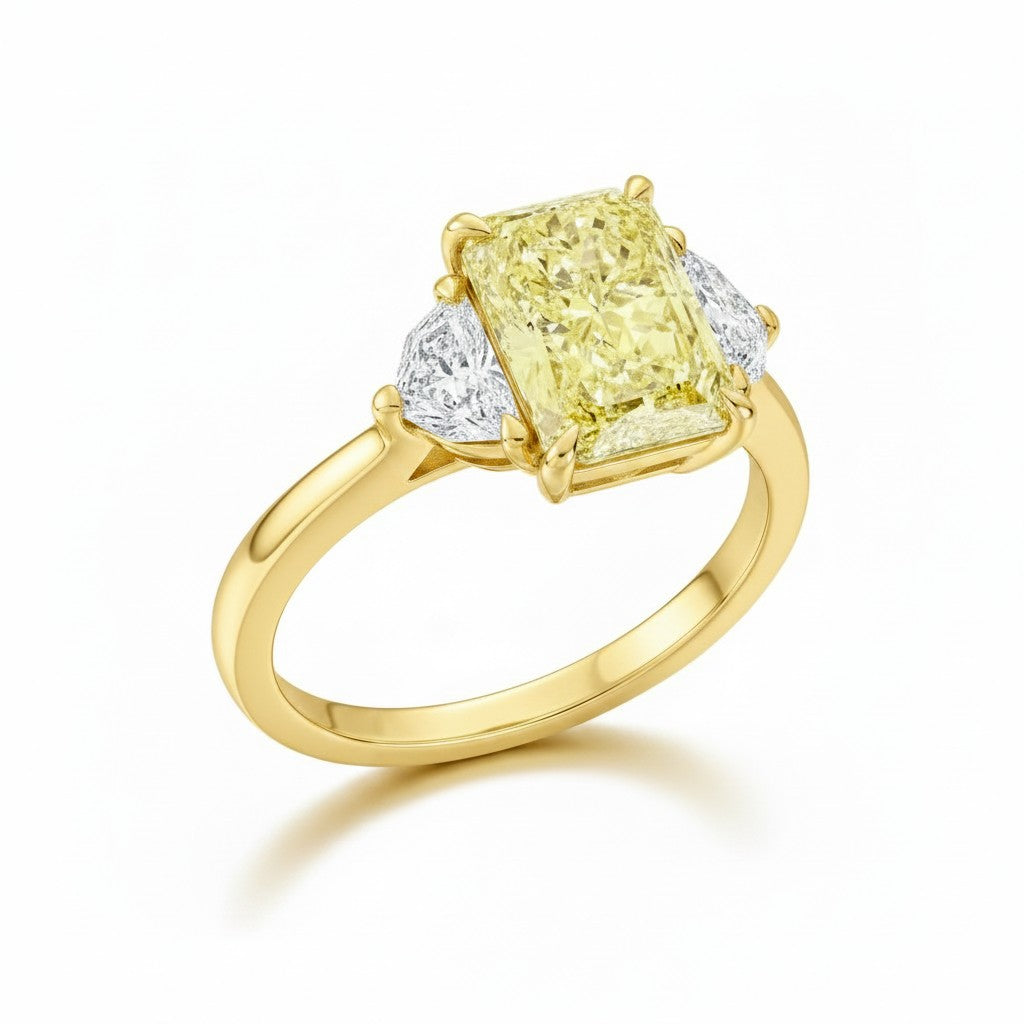 My Store 4 18K solid gold trilogy ring featuring a radiant-cut fancy yellow lab-grown diamond and side stones.
