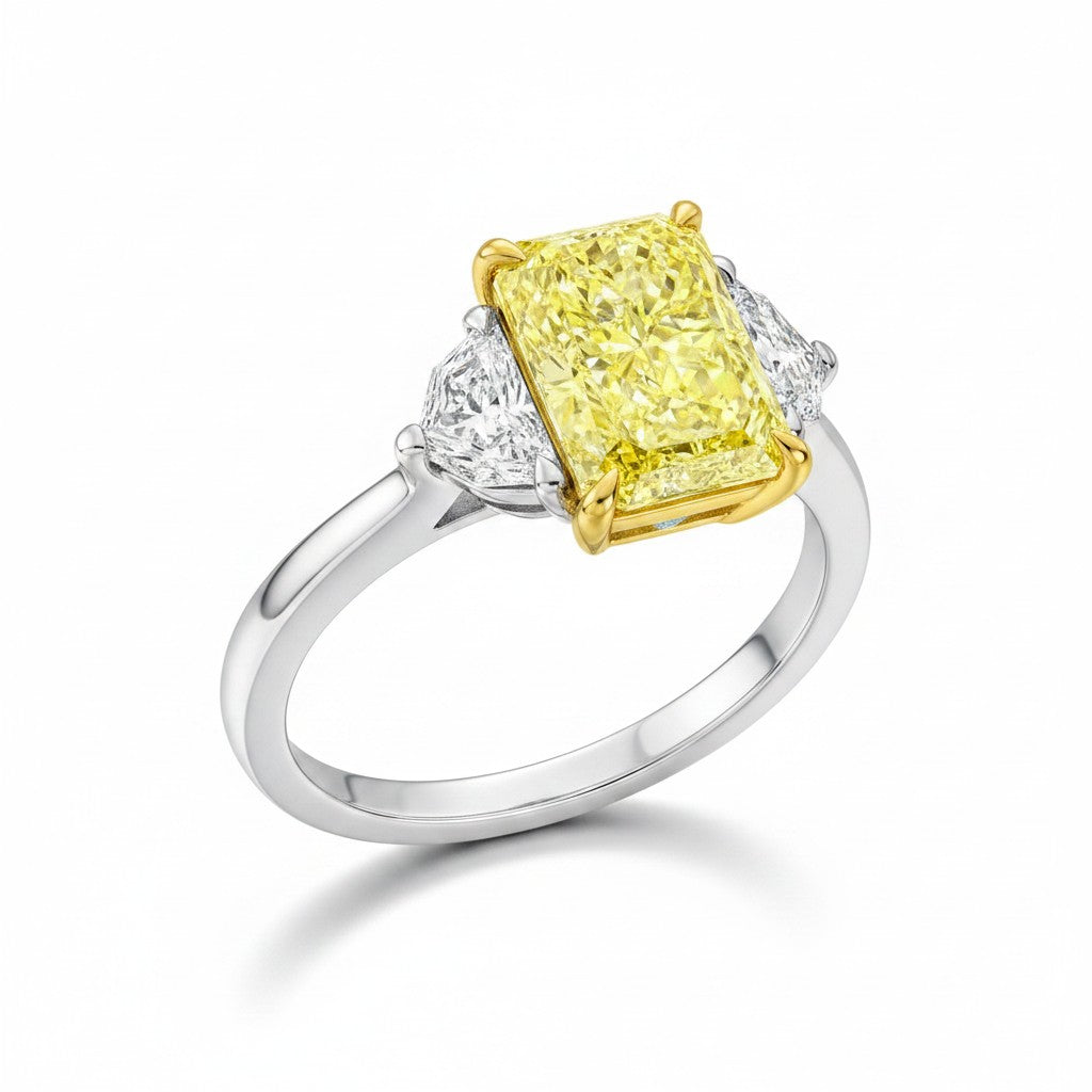 My Store 4 18K gold trilogy ring featuring a radiant-cut fancy yellow lab-grown diamond with side stones.