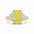 My Store 4 18K solid gold trilogy ring featuring a radiant-cut fancy yellow lab-grown diamond and side stones.