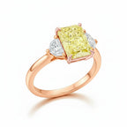 My Store 4 18K rose gold trilogy ring featuring a radiant-cut fancy yellow lab-grown diamond and two side diamonds.