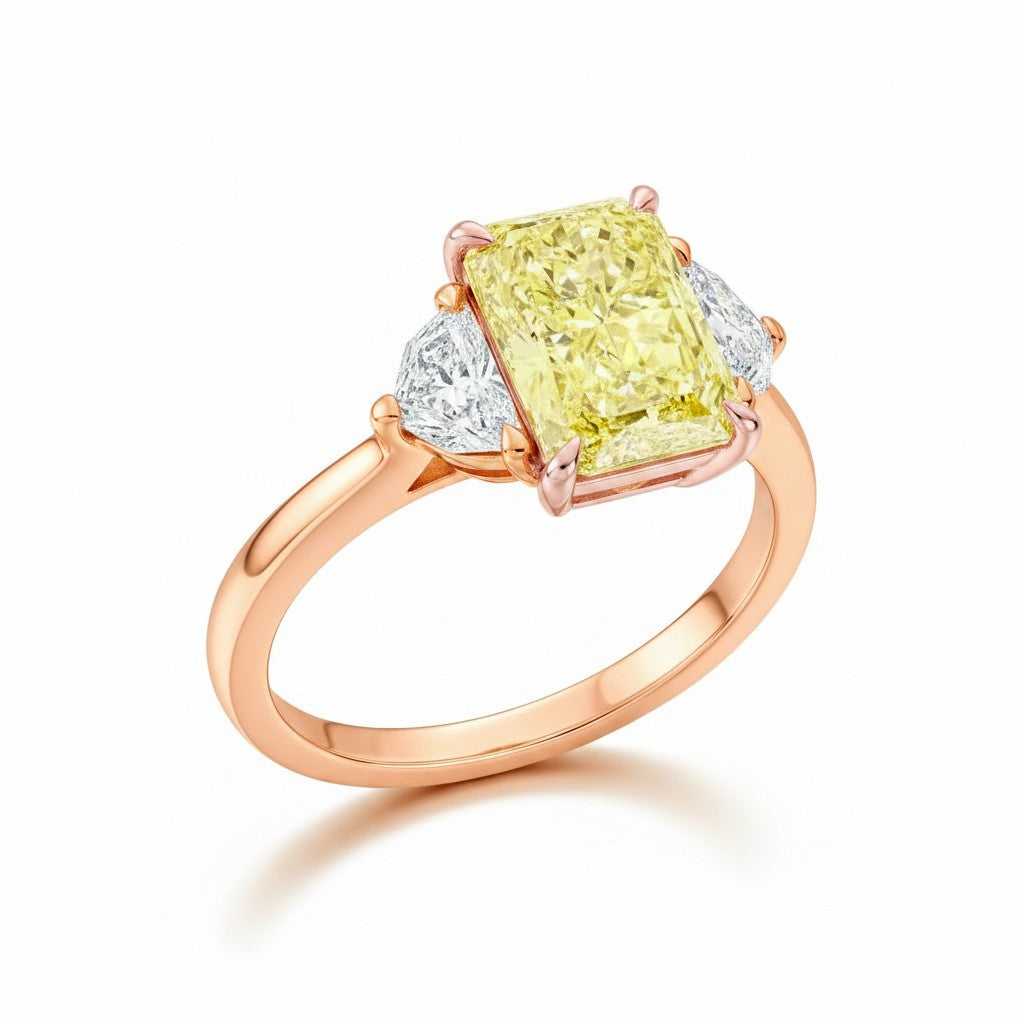 My Store 4 18K rose gold trilogy ring featuring a radiant-cut fancy yellow lab-grown diamond and two side diamonds.