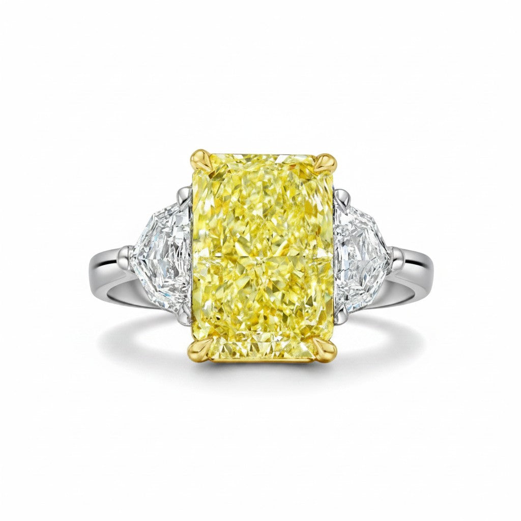 My Store 4 18K gold trilogy ring featuring a radiant-cut fancy yellow lab-grown diamond with side stones.