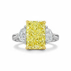 My Store 4 18K gold trilogy ring featuring a radiant-cut fancy yellow lab-grown diamond with side stones.