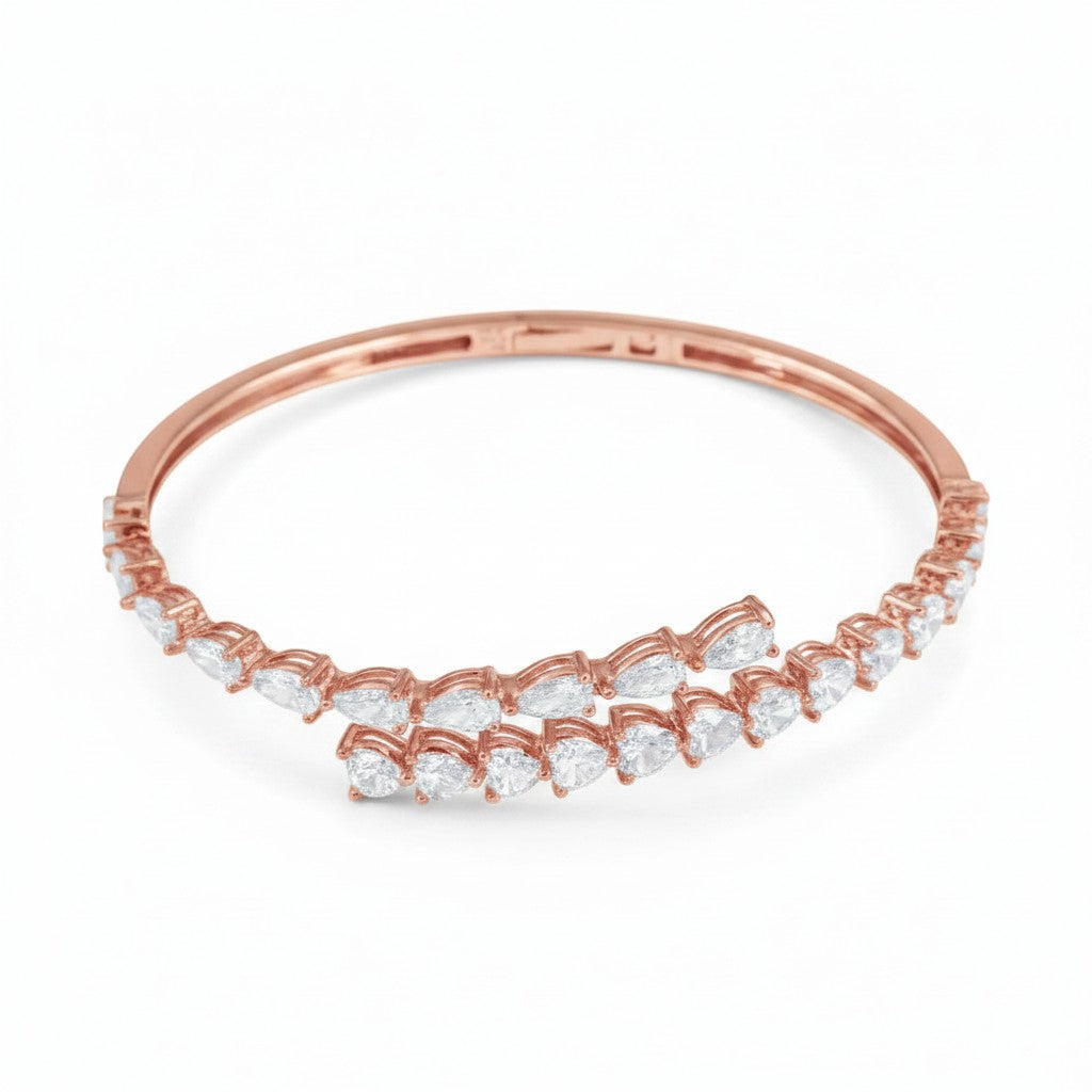 My Store 4 rose gold bypass open bangle bracelet featuring alternating pear and heart cut diamonds on a hinged band.