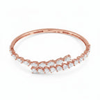 My Store 4 rose gold bypass open bangle bracelet featuring alternating pear and heart cut diamonds on a hinged band.