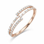 My Store 4 rose gold bypass open bangle bracelet featuring alternating baguette and round brilliant cut diamonds.