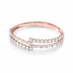 My Store 4 rose gold open bypass bangle bracelet featuring alternating rows of baguette and round brilliant diamonds.