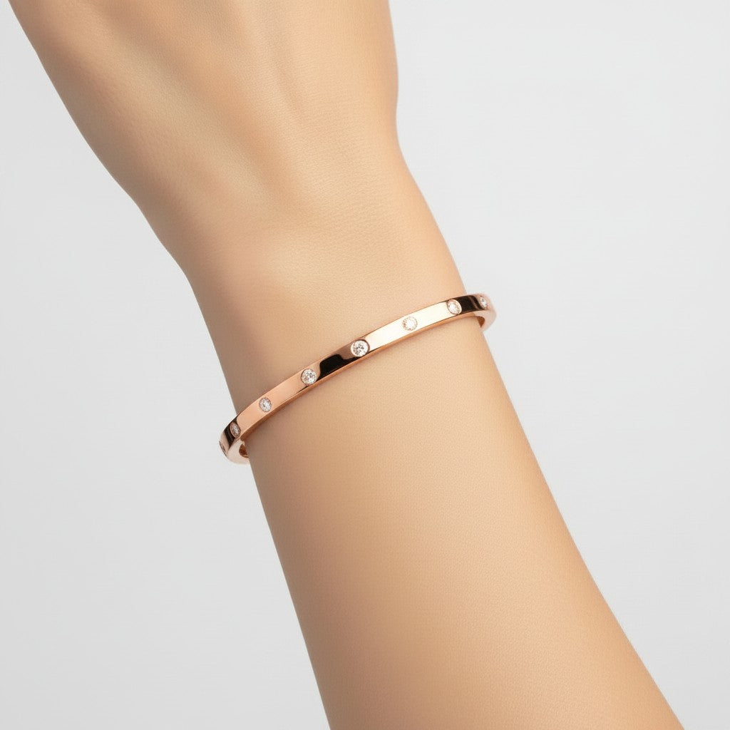 My Store 4 rose gold bangle bracelet featuring round flush-set diamonds worn on a wrist