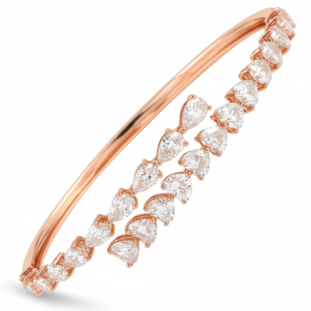 My Store 4 rose gold open bangle bracelet featuring alternating pear and heart cut diamonds in a bypass design.