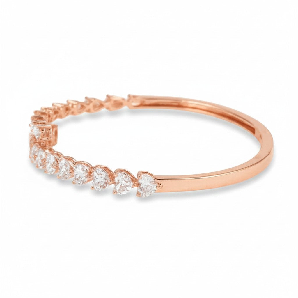 My Store 4 rose gold open bangle bracelet featuring alternating pear and heart cut diamonds in a bypass design.