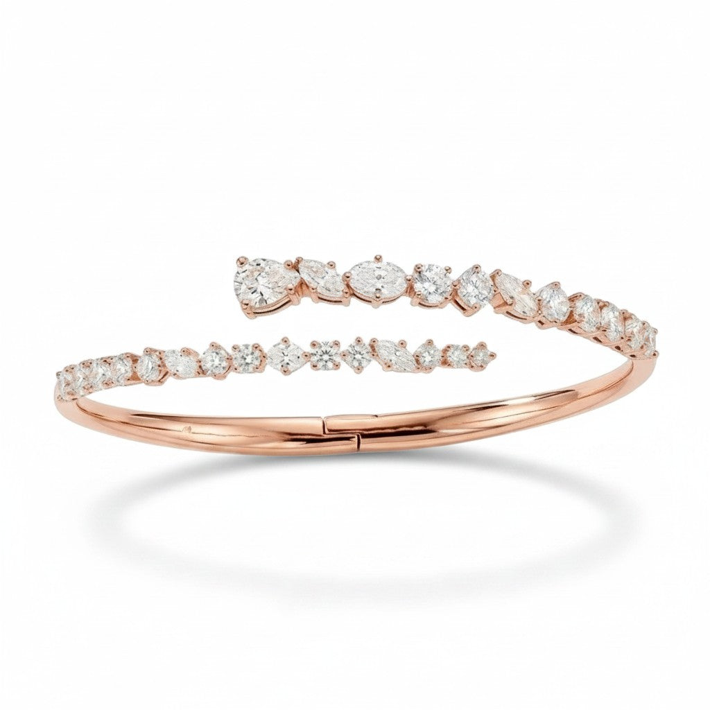 My Store 4 rose gold bypass bangle featuring round, marquise, and pear-cut diamonds in a double-row open cuff design.