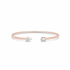 My Store 4 rose gold open cuff bracelet featuring an asymmetrical pear-cut and emerald-cut diamond solitaire.