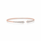 My Store 4 rose gold open cuff bracelet featuring graduated round brilliant diamonds in a shared-prong setting.
