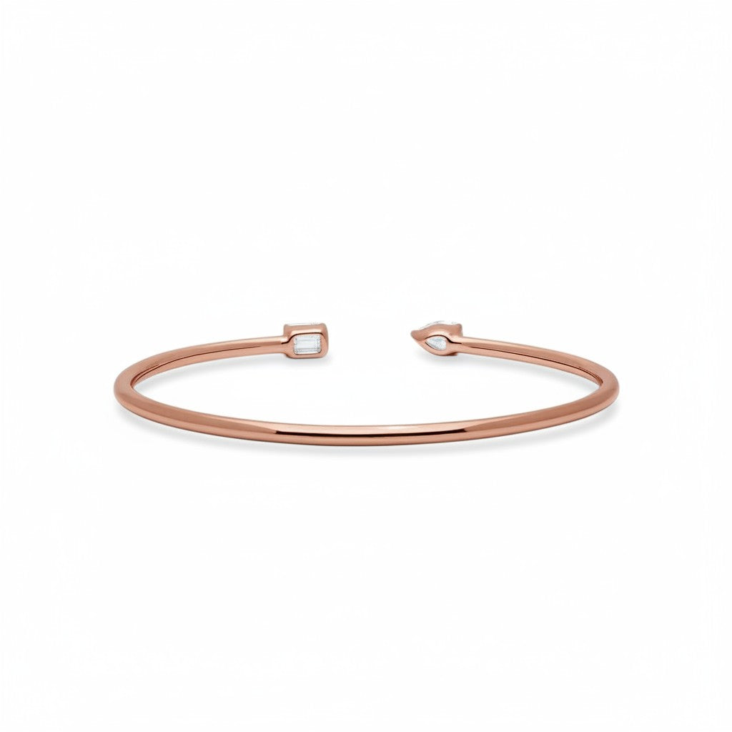 My Store 4 rose gold open cuff bracelet featuring an asymmetrical pear-cut and emerald-cut diamond solitaire design.
