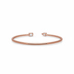 My Store 4 rose gold open cuff bracelet featuring an asymmetrical pear-cut and emerald-cut diamond solitaire design.