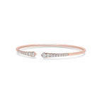 My Store 4 rose gold open cuff bracelet featuring graduated round brilliant diamonds in a shared-prong setting.