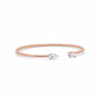 My Store 4 rose gold open cuff bracelet featuring a pear-cut and an emerald-cut diamond on a minimalist band.