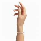 My Store 4 custom rose gold tennis bracelet with round diamonds on a woman's wrist, featuring a 4-prong basket setting.