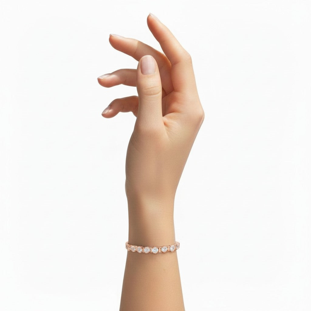 My Store 4 custom rose gold tennis bracelet with round diamonds on a woman's wrist, featuring a 4-prong basket setting.