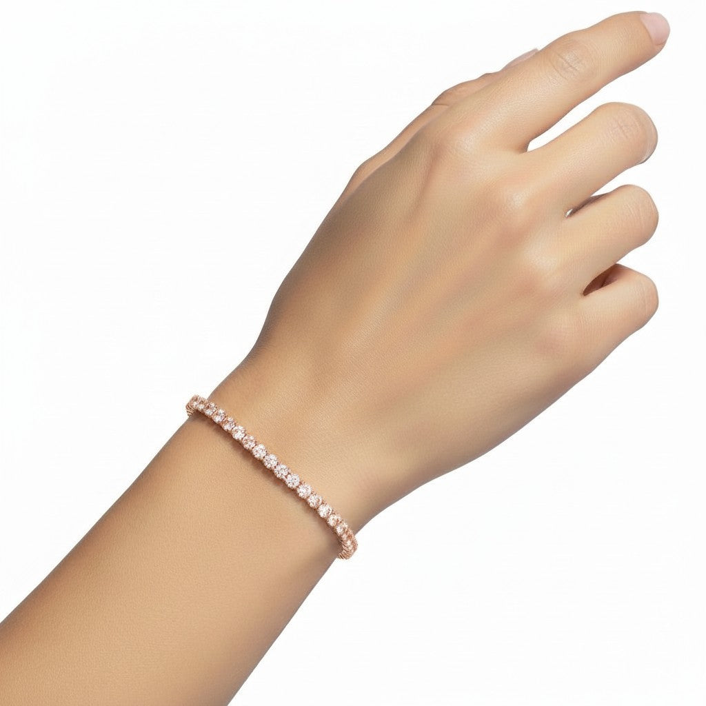 My Store 4 rose gold round diamond tennis bracelet worn on a woman's wrist featuring a low-profile four-prong setting.