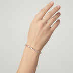 My Store 4 rose gold tennis bracelet featuring an alternating pattern of pear-cut and round-cut diamonds on a wrist.