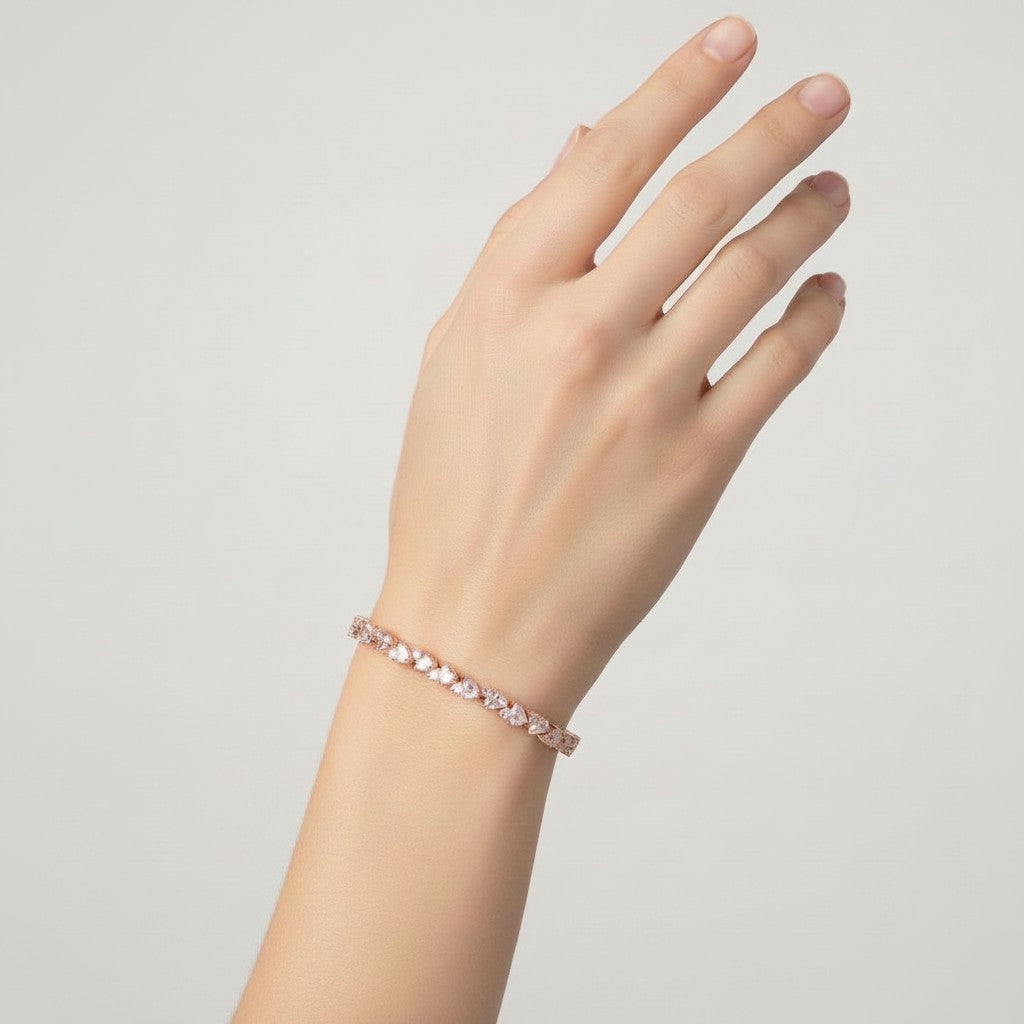 My Store 4 rose gold tennis bracelet featuring an alternating pattern of pear-cut and round-cut diamonds on a wrist.