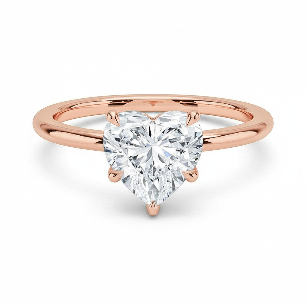 My Store 4 18K rose gold solitaire ring featuring a heart-shaped diamond on a polished band